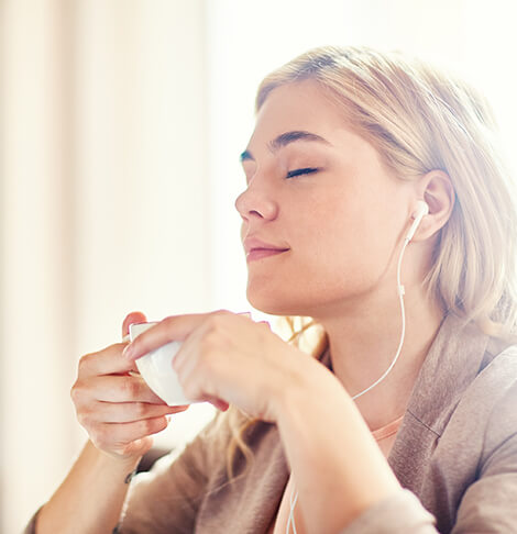 woman enjoying a cup of tea