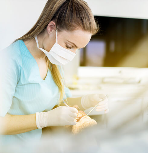 dentist cleaning teeth