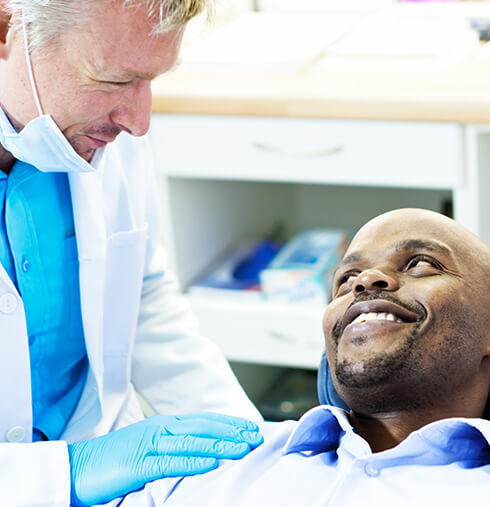 dentist comforting a patient