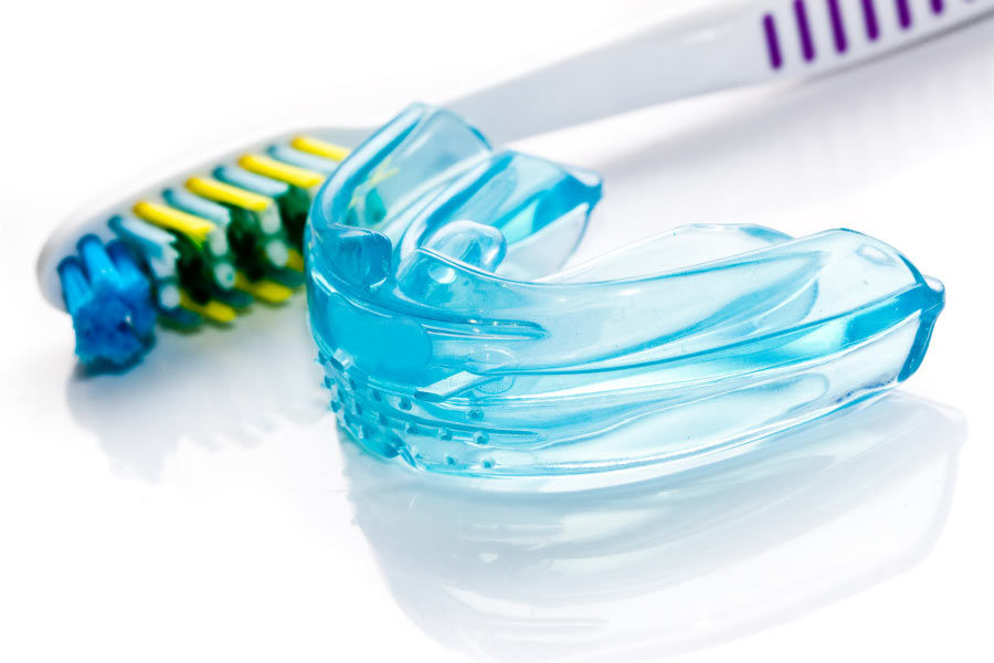 mouthguard with a special cleaning brush