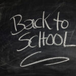back to school written on a black board