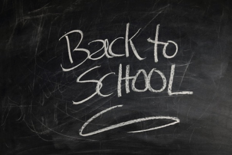 back to school written on a black board