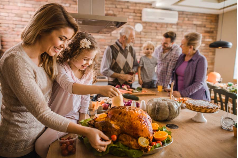 extended family in the kitchen getting ready for Thanksgiving dinner