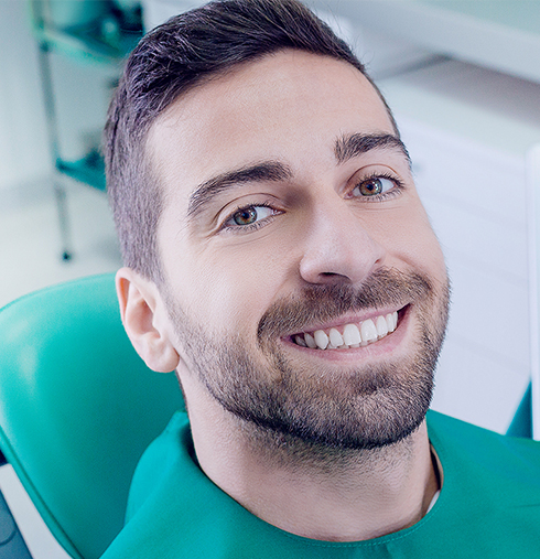 smiling man at the dentist