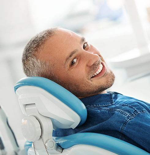 smiling man at dentist